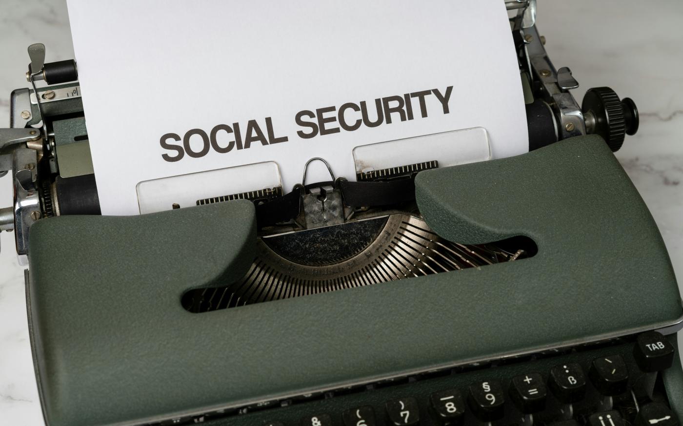 a close up of a typewriter with a paper that says social security by Markus Winkler courtesy of Unsplash.