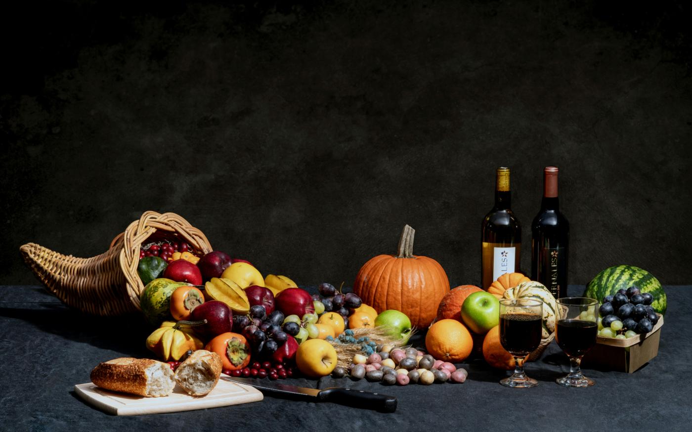 pumpkin and bottles on table by Brad Switzer courtesy of Unsplash.