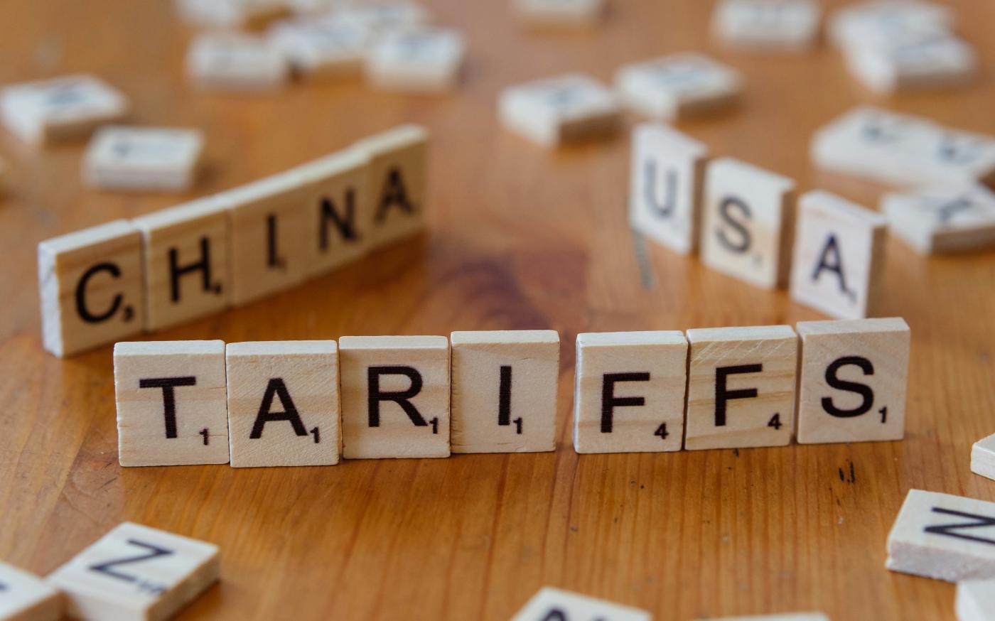 A close up of scrabble tiles spelling the word china by Markus Winkler courtesy of Unsplash.