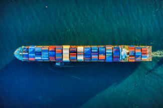 aerial view of boat on water by Venti Views courtesy of Unsplash.