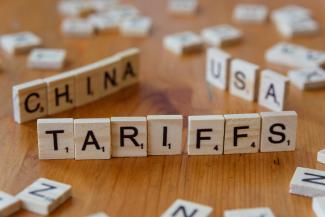 A close up of scrabble tiles spelling the word china by Markus Winkler courtesy of Unsplash.